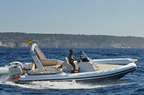 Man driving inflatable motorboat on open sea